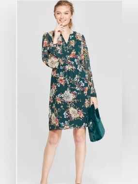 A NEW DAY. beige label on black fabric